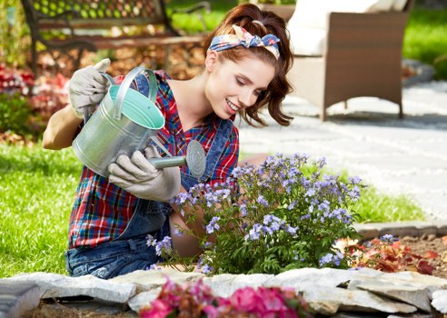 Investigator inspecting lawn and plants